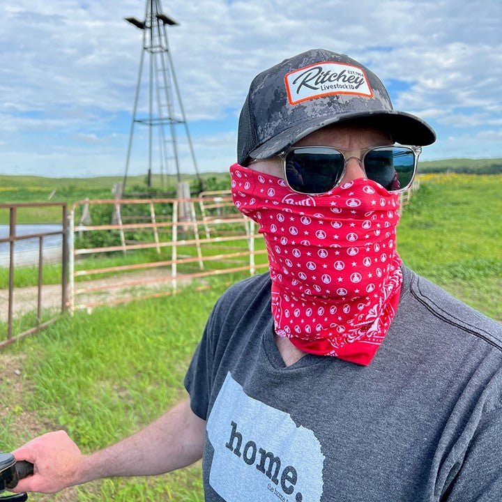 Red and White bandana print multi-functional neck gaiter features CoolNet® UV (95% recycled) - engineered with REPREVE® performance microfiber, HeiQ cooling technology, Polygiene® odor control and has a 4-Way ULTRA STRETCH fabric construction that features UPF 50 sun protection.